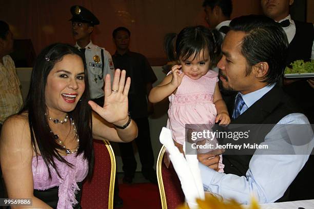 World welterweight boxing champion Manny Pacquiao is seen with his daughter Queen Pacquiao and wife Jinkee Pacquiao at the KCC Mall on May 15, 2010...