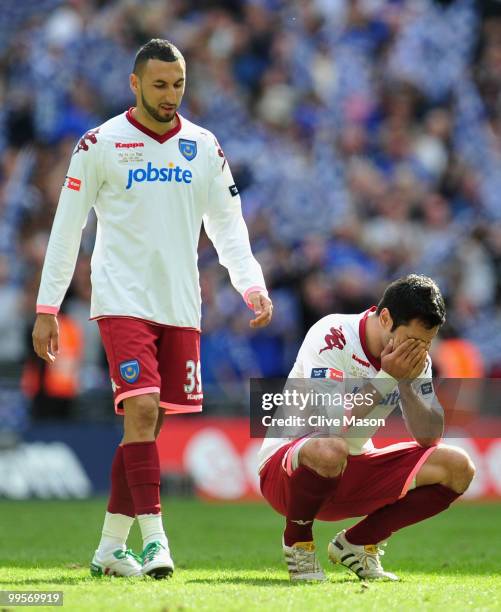 Nadir Belhadj and Ricardo Rocha of Portsmouth look dejected at the end of the FA Cup sponsored by E.ON Final match between Chelsea and Portsmouth at...