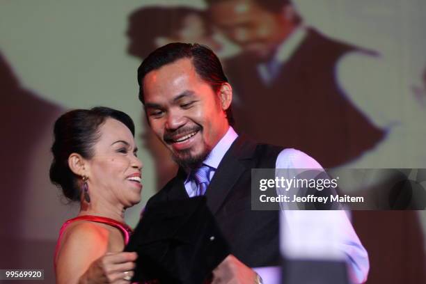 World welterweight boxing champion Manny Pacquiao is seen with his mother Dionisia Pacquiao at the KCC Mall on May 15, 2010 in General Santos,...