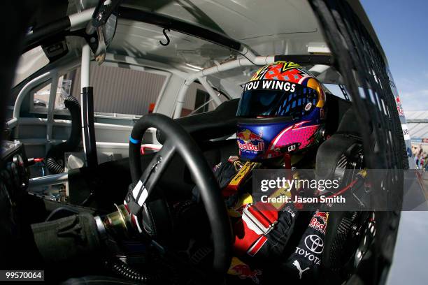 Scott Speed sits in the Red Bull Toyota prior to practice for the NASCAR Sprint Cup Series Autism Speaks 400 at Dover International Speedway on May...