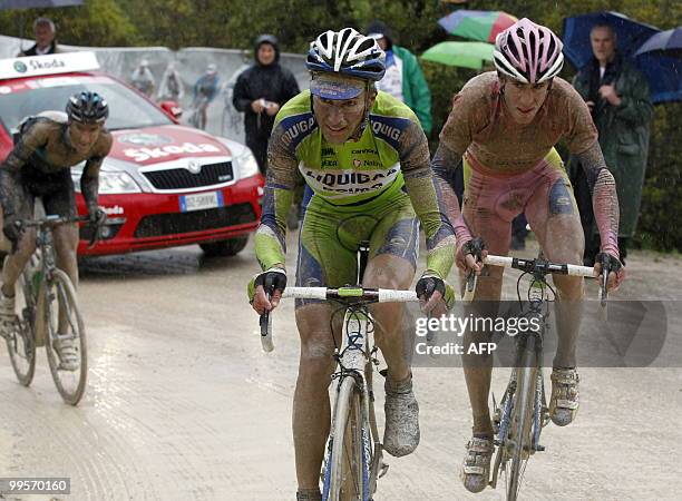 Italy's Ivan Basso and Vincenzo Nibali ride on the "strade bianche" of Tuscany during the seventh stage of the 93rd Giro d'Italia going from Carrara...