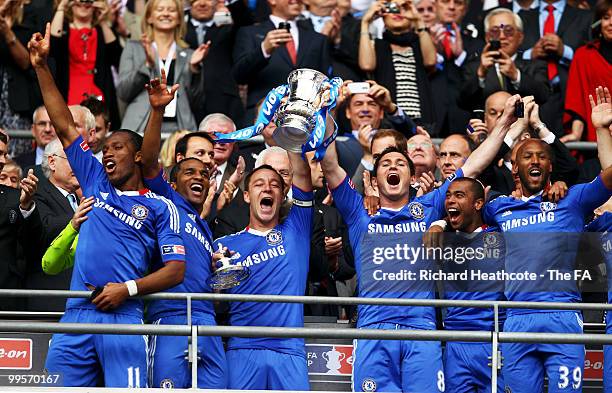 John Terry and Frank Lampard of Chelsea lift the trophy as their team-mates celebrate victory in the FA Cup sponsored by E.ON Final match between...