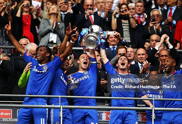 John Terry and Frank Lampard of Chelsea lift the trophy as their team-mates celebrate victory in the FA Cup sponsored by E.ON Final match between...