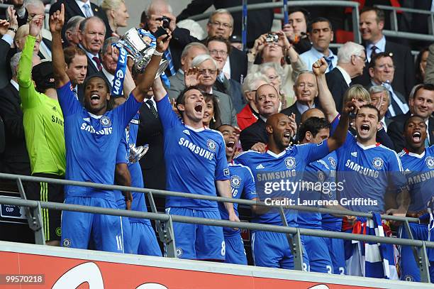 John Terry of Chelsea lifts the trophy with his team mates following their victory at the end of the FA Cup sponsored by E.ON Final match between...