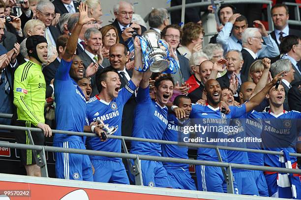 John Terry of Chelsea lifts the trophy with his team mates following their victory at the end of the FA Cup sponsored by E.ON Final match between...