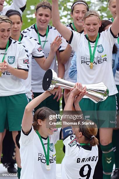 Annike Krahn and Inka Grings celebrate after the DFB Women's Cup final match between FCR 2001 Duisburg and FF USV Jena at RheinEnergie stadium on May...