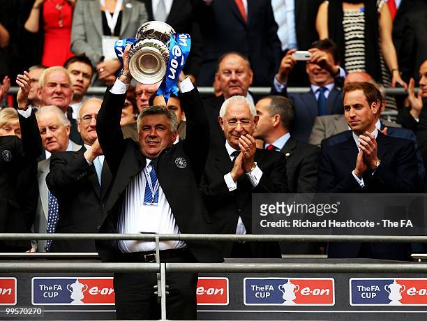 Carlo Ancelotti, manager of Chelsea, holds the trophy aloft following his sides victory in the FA Cup sponsored by E.ON Final match between Chelsea...