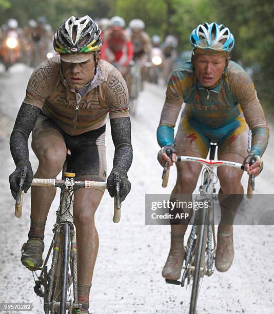 Australian Cadel Evans and Kazakhstan's Alexandre Vinokourov ride on the "strade bianche" of Tuscany during the seventh stage of the 93rd Giro...