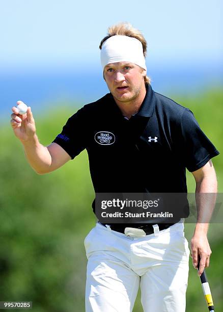 Pelle Edberg of Sweden waves his ball on the 12th hole during the third round of the Open Cala Millor Mallorca at Pula golf club on May 15, 2010 in...