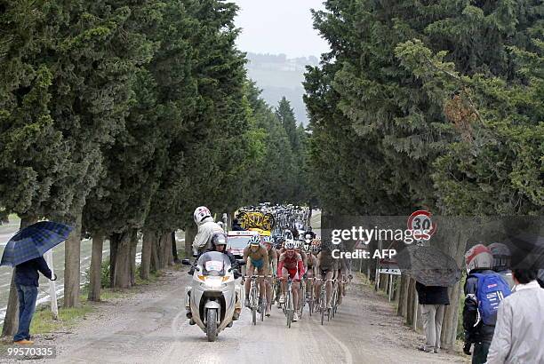 Competitors ride on the "strade bianche" of Tuscany during the seventh stage of the 93rd Giro d'Italia going from Carrara to Montalcino on May 15,...