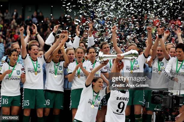 Inka Grings and Annike Krahn of Duisburg hold up the trophy after winning the DFB Women's Cup final match between FCR 2001 Duisburg and FF USV Jena...