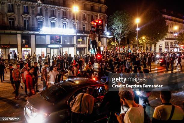 France fans celebrate after France qualifies for the final of the 2018 FIFA World Cup after their 1-0 victory over Belgium at Place de la Republique...