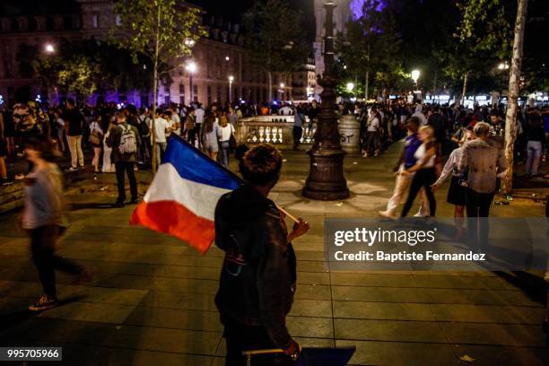 France fans celebrate after France qualifies for the final of the 2018 FIFA World Cup after their 1-0 victory over Belgium at Place de la Republique...