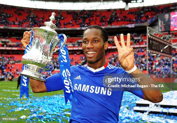 Didier Drogba of Chelsea celebrates with the trophy following victory in FA Cup sponsored by E.ON Final match between Chelsea and Portsmouth at...