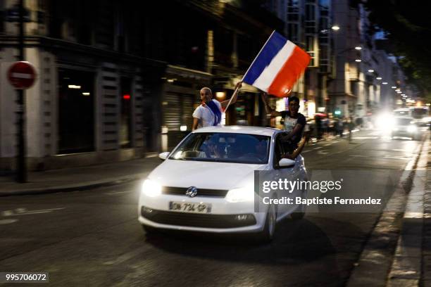 France fans celebrate after France qualifies for the final of the 2018 FIFA World Cup after their 1-0 victory over Belgium at Place de la Republique...