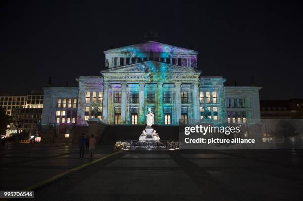 The 'Konzerthaus' music venue stands illuminated on the Gendarmenmarkt square during the kick-off event of the 'Berlin leuchtet' festival of light in...