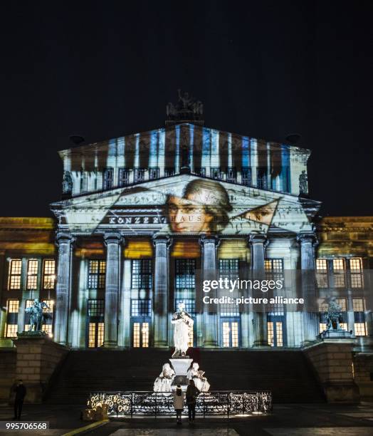 Dpatop - The 'Konzerthaus' music venue stands illuminated on the Gendarmenmarkt square during the kick-off event of the 'Berlin leuchtet' festival of...