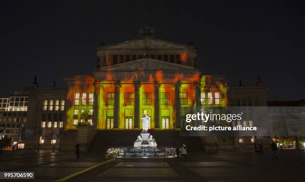 The 'Konzerthaus' music venue stands illuminated on the Gendarmenmarkt square during the kick-off event of the 'Berlin leuchtet' festival of light in...