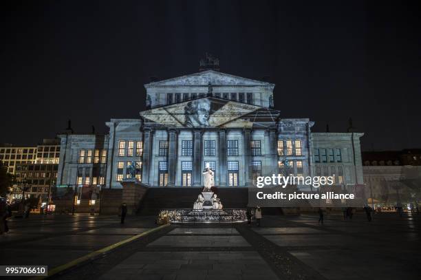 The 'Konzerthaus' music venue stands illuminated on the Gendarmenmarkt square during the kick-off event of the 'Berlin leuchtet' festival of light in...