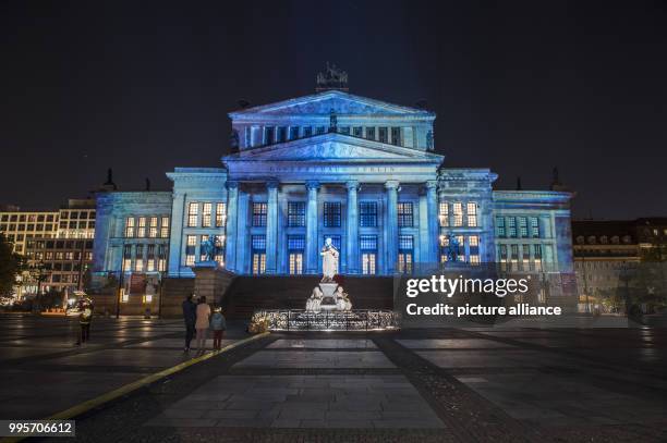 The 'Konzerthaus' music venue stands illuminated on the Gendarmenmarkt square during the kick-off event of the 'Berlin leuchtet' festival of light in...