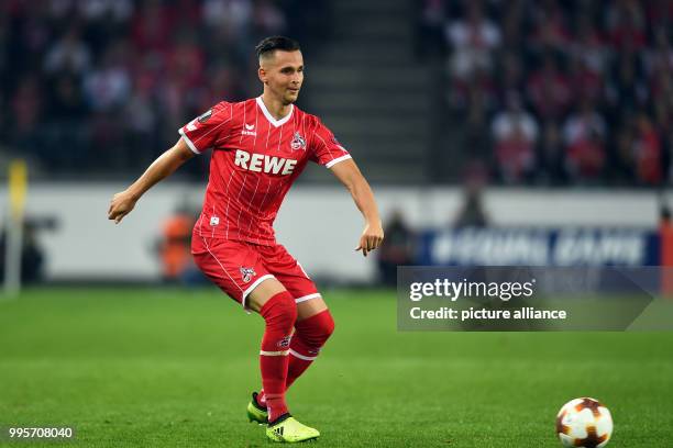Cologne's Pawel Olkowski plays the ball during the Europa League match between 1.FC Cologne and Red Star Belgrade at the RheinEnergieStadium in...