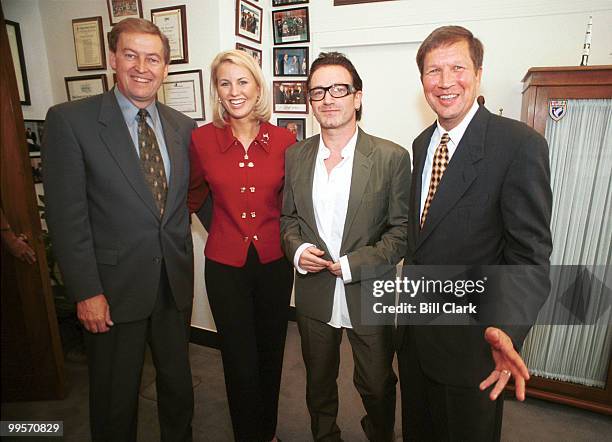 Left to right: Sen. Rod Grams , Miss Minnesota Katherine Hill, Bono of U2, and Rep. John Kasich pose for a group photo after a meeting on third world...