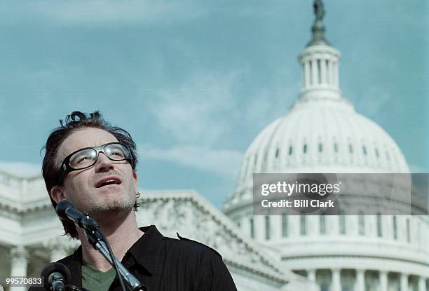 Bono of U2 speaks during a press conference on third world debt relief at the US Capitol.