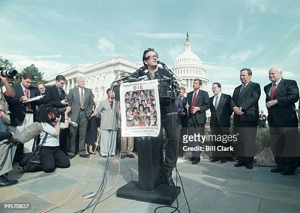 Bono of U2 speaks during a press conference on third world debt relief at the US Capitol.