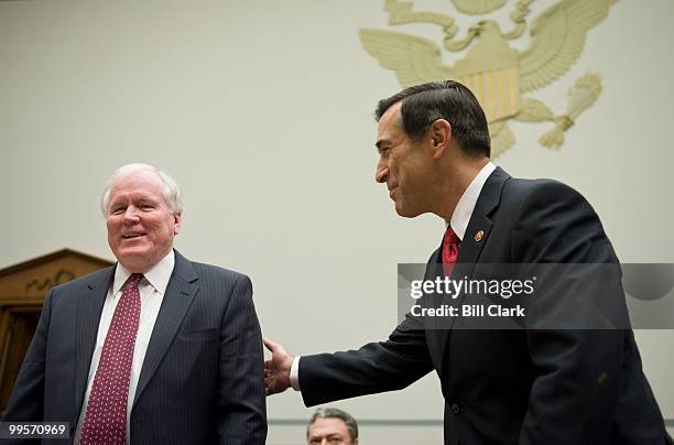 Edward Liddy, left, talks with Rep. Darrell Issa, R-Calif., before the start of the House Oversight and Government Reform Committee hearing on "AIG:...