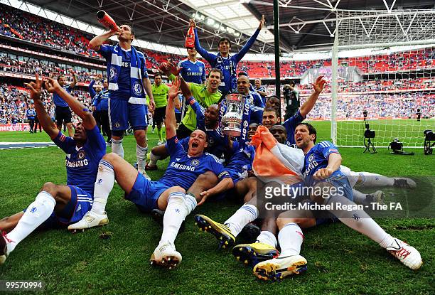 The Chelsea players celebrate with the trophy following their victory in the FA Cup sponsored by E.ON Final match between Chelsea and Portsmouth at...