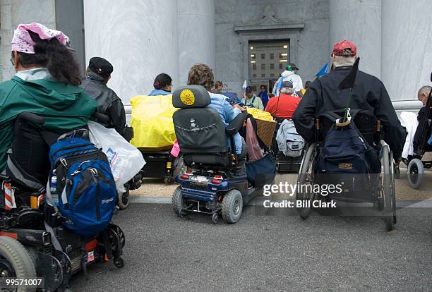 Members of the disability-rights organization ADAPT wait outside of Rayburn to go through security to attend the House Constitution Subcommittee's...