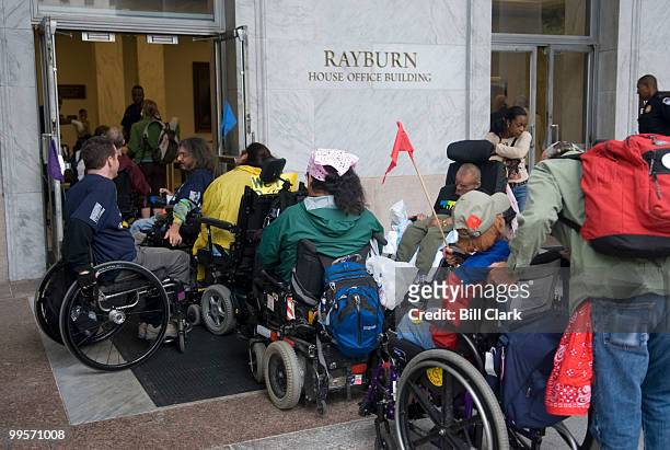 Members of the disability-rights organization ADAPT wait outside of Rayburn to go through security to attend the House Constitution Subcommittee's...