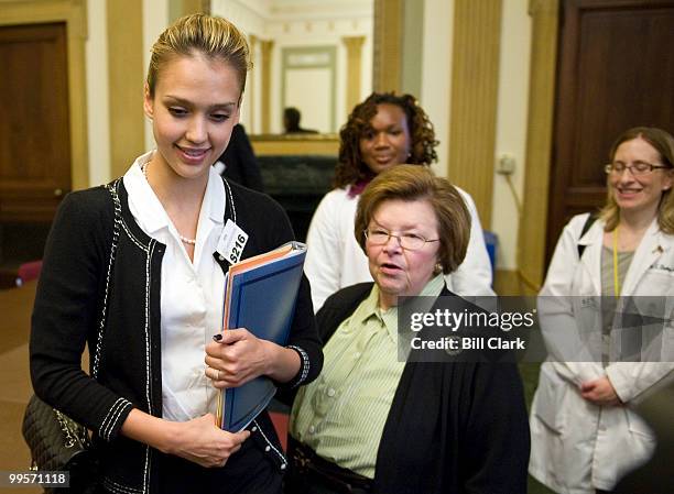 Actress Jessica Alba, left, talks to Sen. Barbara Mikulski, D-Md., at the conclusion of a meeting with prominent women and children's advocates to...