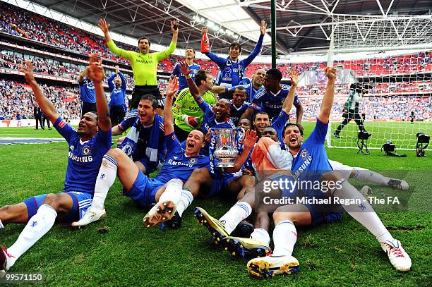 The Chelsea players celebrate with the trophy following their victory in the FA Cup sponsored by E.ON Final match between Chelsea and Portsmouth at...