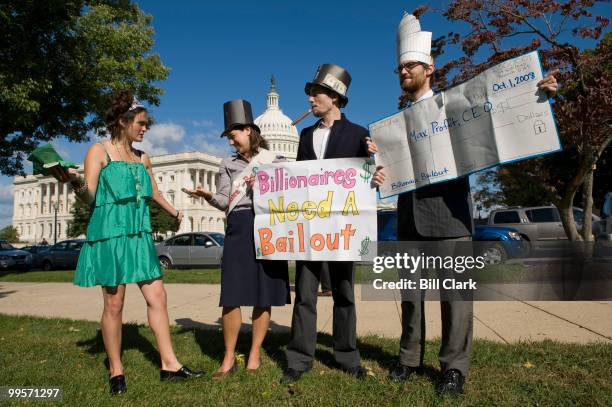 From left, Billionaires for Bailouts members Avana Yacht , Meg A. Bucks , Max Profit and Sen. Jack Betrayus conduct some political theater on the...