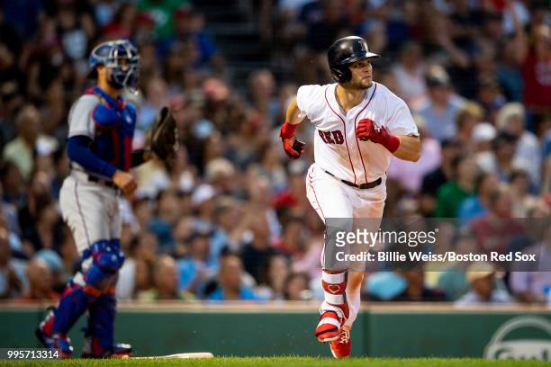Andrew Benintendi of the Boston Red Sox hits an RBI double during the third inning of a game against the Texas Rangers on July 10, 2018 at Fenway...