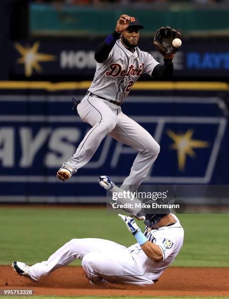 Carlos Gomez of the Tampa Bay Rays steals second as Niko Goodrum of the Detroit Tigers fields the throw in the third inning during a game at...