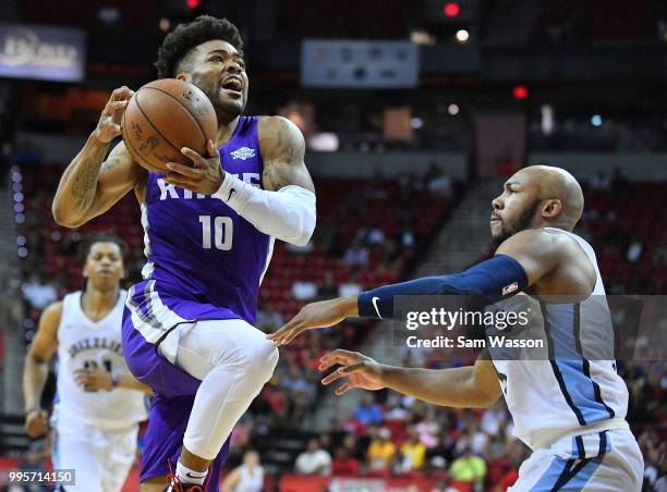 Frank Mason III of the Sacramento Kings drives against Jevon Carter of the Memphis Grizzlies during the 2018 NBA Summer League at the Thomas & Mack...