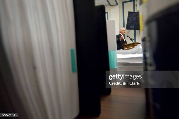Rep. Howard Berman, D-Calif., is seen through stacks of petitions as he speaks during a news conference held by the NEA on H.R.82, the "Social...