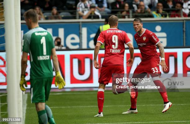 Stuttgart's Simon Terodde celebrates his equaliser goal with Daniel Ginczek during the German Bundesliga match between Eintrach Frankfurt and...