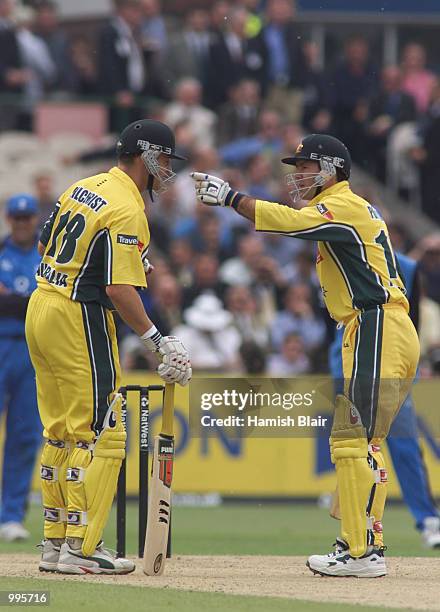 Adam Gilchrist of Australia has some pollen removed from his eyes by team mate Ricky Ponting, during the One Day International between England and...