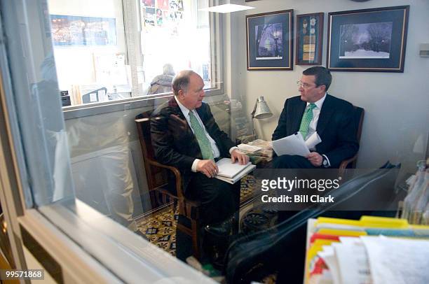 From left, House Budget Chairman John Spratt, D-S.C., and Senate Budget Chairman Kent Conrad, D-N.Dak., meet in an empty office in the House Radio/TV...
