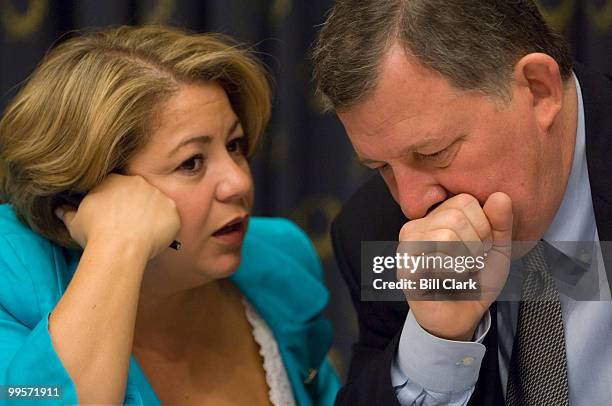 Chairwoman Linda Sanchez, D-Calif., speaks with Rep. Chris Cannon, R-Utah, after the House Subcommittee on Commercial and Administrative Law voted to...