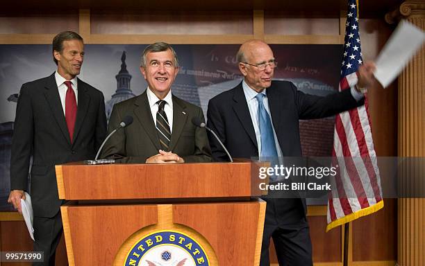 From left, Sen. John Thune, R-S. Dak., Sen. Mike Johanns, R-Neb., and Sen. Pat Roberts, R-Kan., wait for the TV lights to come on in the Senate...