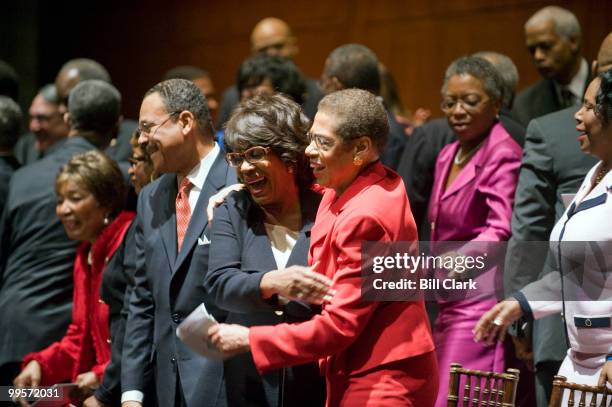 Members of the Congressional Black Caucus Rep. Maxine Waters, D-Calif., and Del. Eleanor Holmes Norton, D-D.C., hug during the CBC ceremonial...