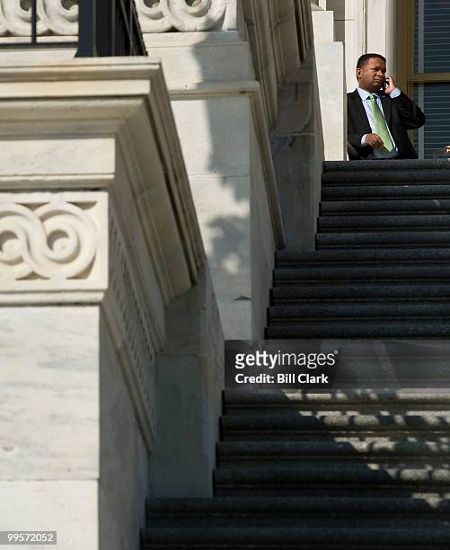 Rep. Artur Davis, D-Ala., talks on his cell phone between votes at the top of the House steps on Friday, March 19, 2010.