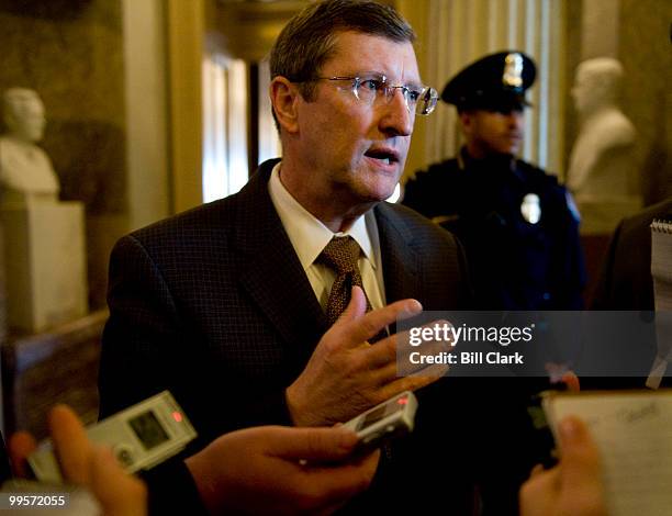 Sen. Kent Conrad, D-N. Dak., speaks with reporters as he leaves the Senate Floor following a vote on Thursday afternoon, March 12, 2009.