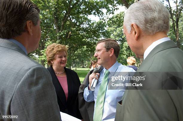 From left, Sen. Gordon Smith, R-Ore., Sen. Debbie Stabenow, D-Mich., Sen. Kent Conrad, D-N.D., and Sen. Orrin Hatch, R-Utah, talk before the start of...