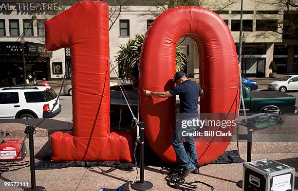 Census worker sets up an inflated "10" before the start of the National Census Day rally at Freedom Plaza in Washington on Thursday, April 1, 2010.