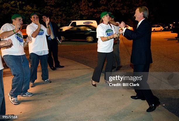 Sen. Lincoln Chafee, R-R.I., right, does a little dance with supporters and his wife Stephanie after the Chafee/Whitehouse debate at Toll Gate High...